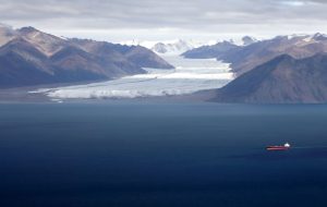 Receding glacier with tanker in foreground